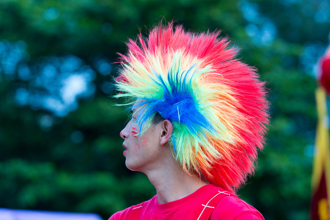 A stilt walker, wearing a colorful hat during the Hue Festival 2014, Thua ThienâHue Province, Viet Nam, Indochina, South East Asia.