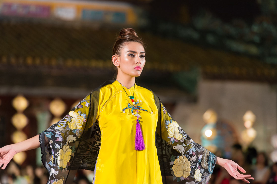 Model wearing a  Vietnamese dress during the Oriental Night at Hue Festival 2014, Thua ThienâHue Province, Viet Nam, Indochina, South East Asia.