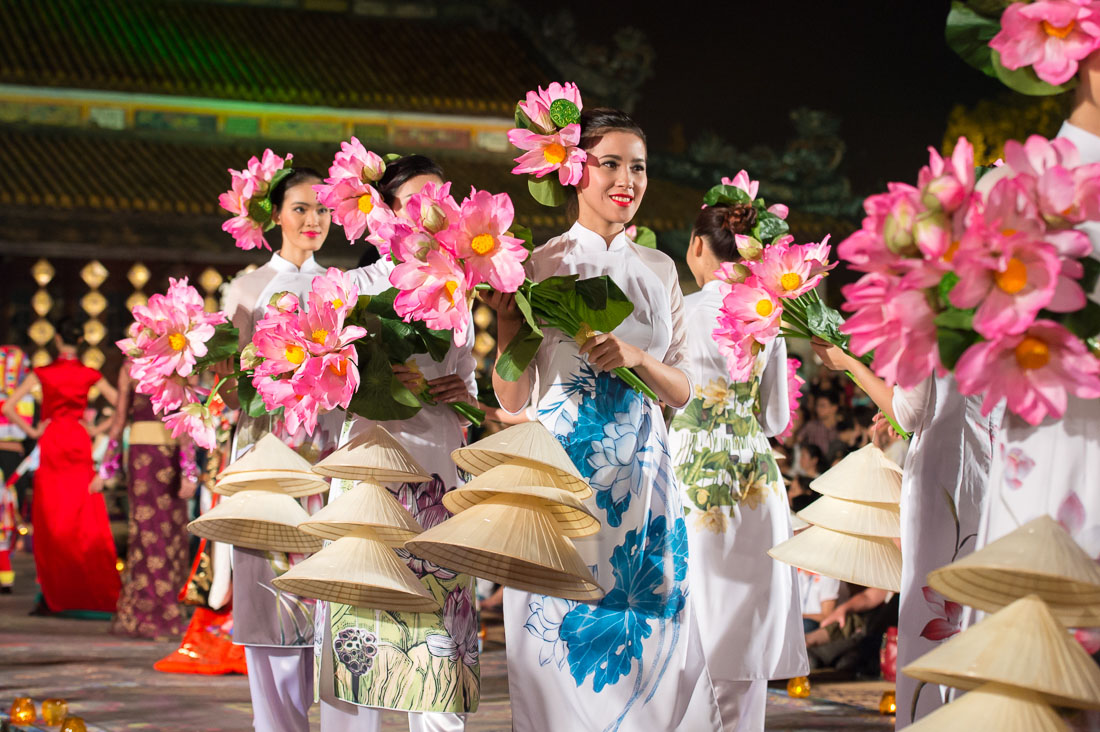 Vietnamese models wearing the traditional dress, the ao dai, during the Oriental Night at Hue Festival 2014, Thua ThienâHue Province, Viet Nam, Indochina, South East Asia.