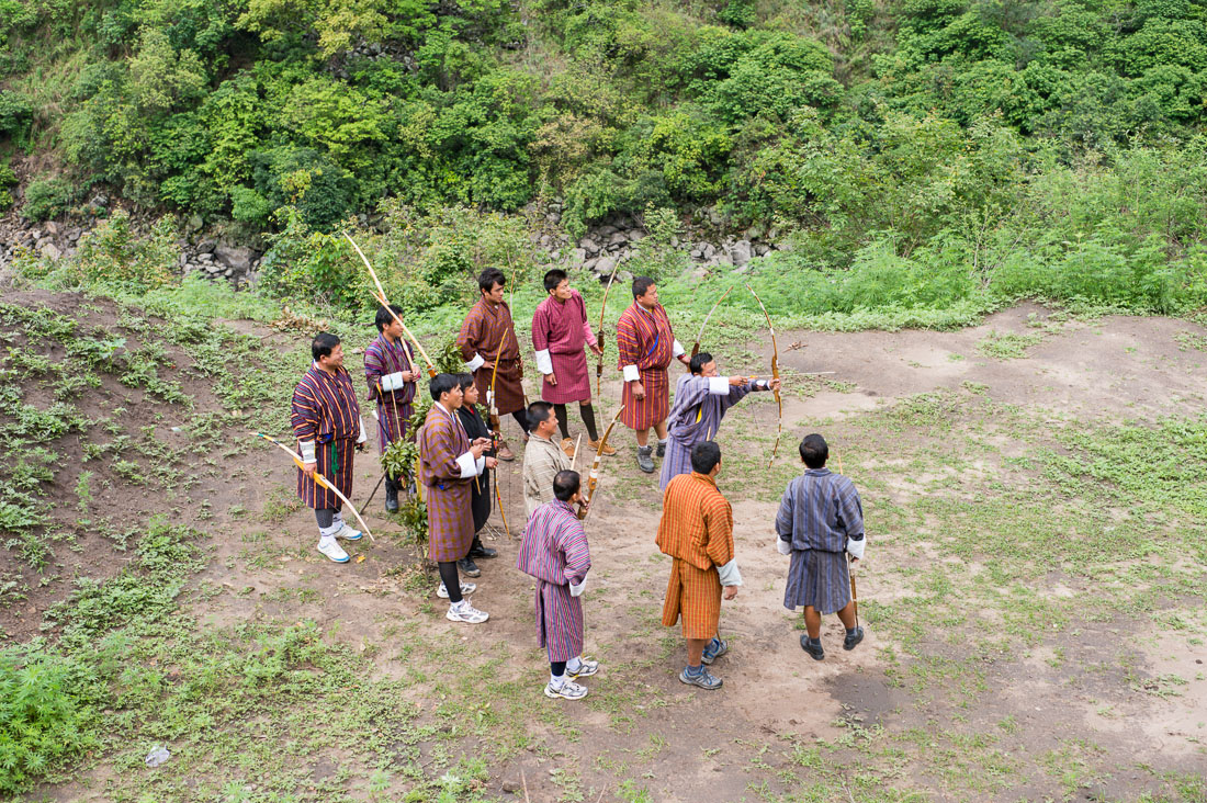 Archers, wearing Bhutanese traditional costumes, with bamboo made bow competing for a 500 feet target, Kingdom of Bhutan, Asia