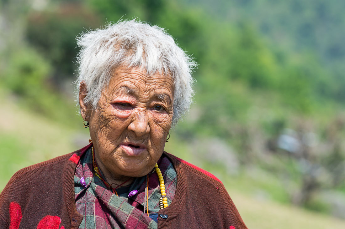 Old woman in the countryside, Kingdom of Bhutan, Asia