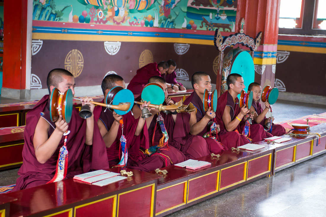 Buddhist monks performing a ritual using drums, bells and trumpets, Rangjung monastery, Kingdom of Bhutan, Asia