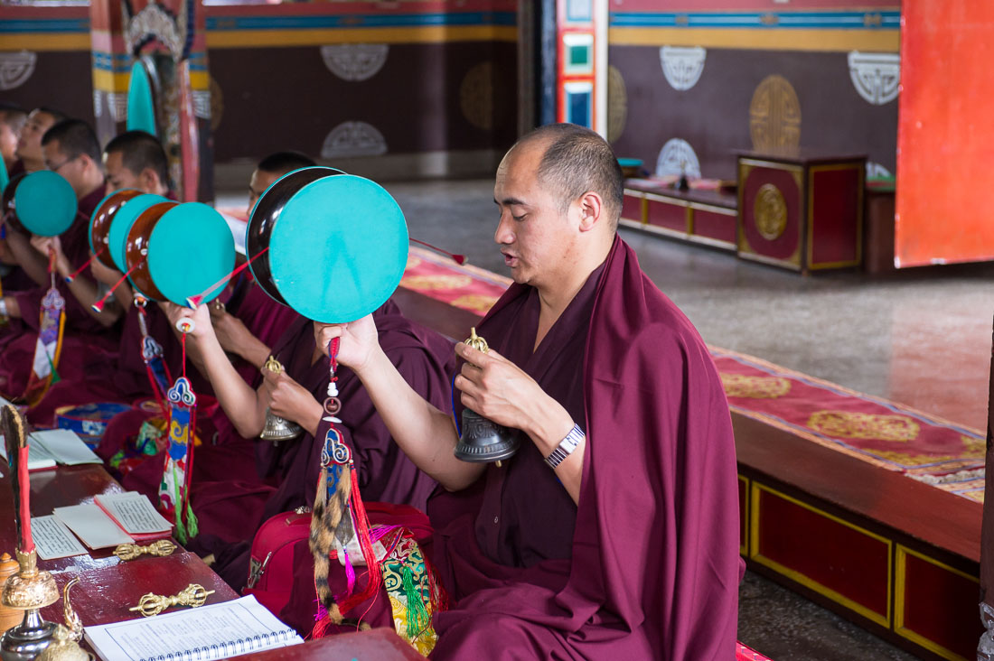 Buddhist monks performing a ritual using drums, bells and trumpets, Rangjung monastery, Kingdom of Bhutan, Asia