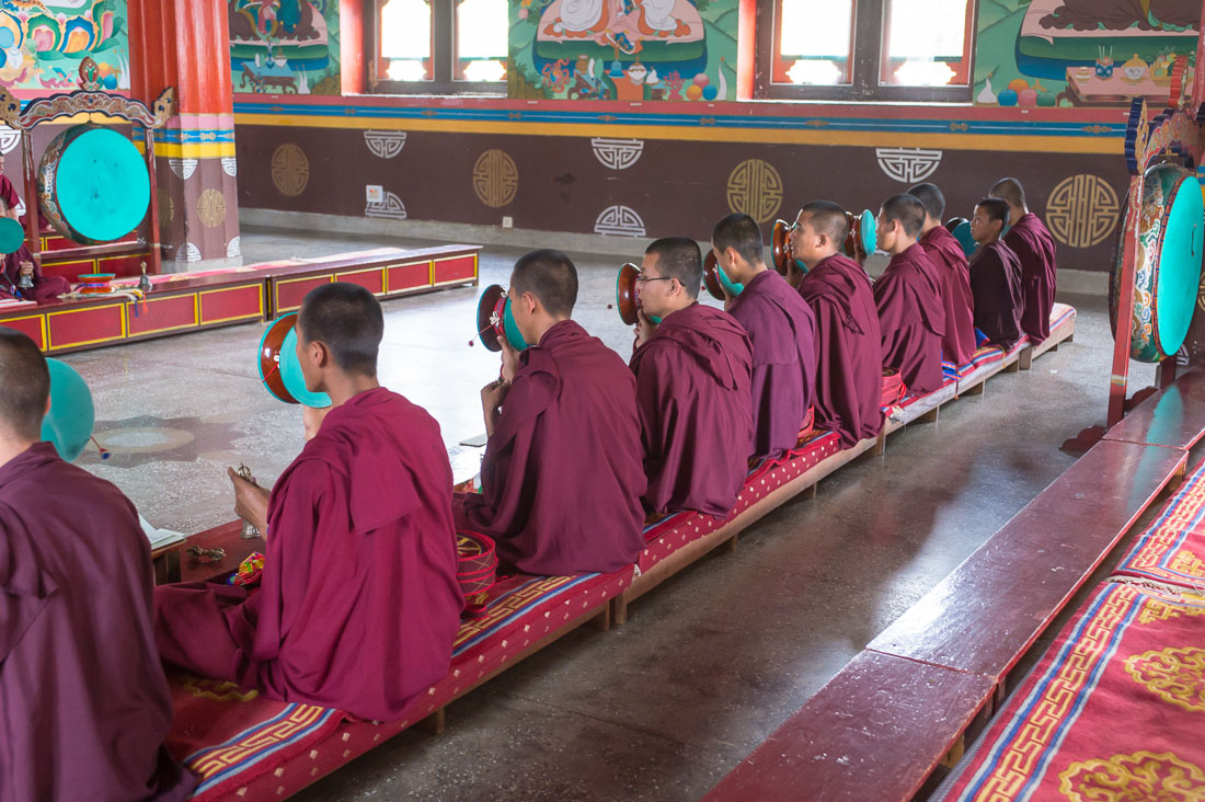 Buddhist monks performing a ritual using drums, bells and trumpets, Rangjung monastery, Kingdom of Bhutan, Asia