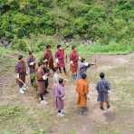 Archers, wearing Bhutanese traditional costumes, with bamboo made bow competing for a 500 feet target, Kingdom of Bhutan, Asia