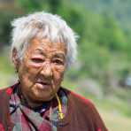 Old woman in the countryside, Kingdom of Bhutan, Asia