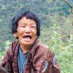 Old woman in the countryside, Kingdom of Bhutan, Asia