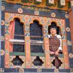 A woman looking out from her window, Kingdom of Bhutan, Asia