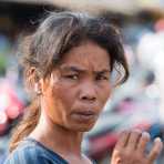 Smoking woman at the Stung Treng market, Stung Treng province. Kingdom of Cambodia, Indochina, South East Asia