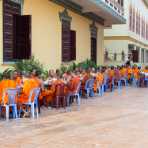 Buddhist monks enjoying morning breakfast, Ounalom pagoda. Phnom Penh, Kingdom of Cambodia, Indochina, South East Asia