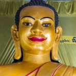 Face from a large Buddha statue in the Wat Leo in Siem Reap. Kingdom of Cambodia, Indochina, South East Asia.