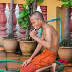 Buddhist monk brushing his teeth, Phnom Penh, Kingdom of Cambodia, Indochina, South East Asia