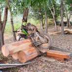 A custom made motorcycle designed to transport heavy timber illegally cut deep inside the Seima protected forest, (the tree logs are close to 2,000 pounds). Mondulkiri province, Kingdom of Cambodia, Indochina, South East Asia