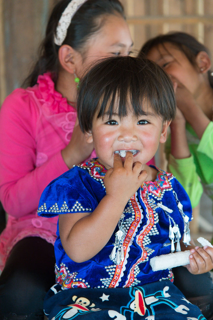 Little boy wearing the traditional costume of the La Hu ethnic minority people, Loa Ba Dao village, Lan Cang county, Yunnan Province, China, Asia. Nikon D4, 24-120mm, f/4.0, VR