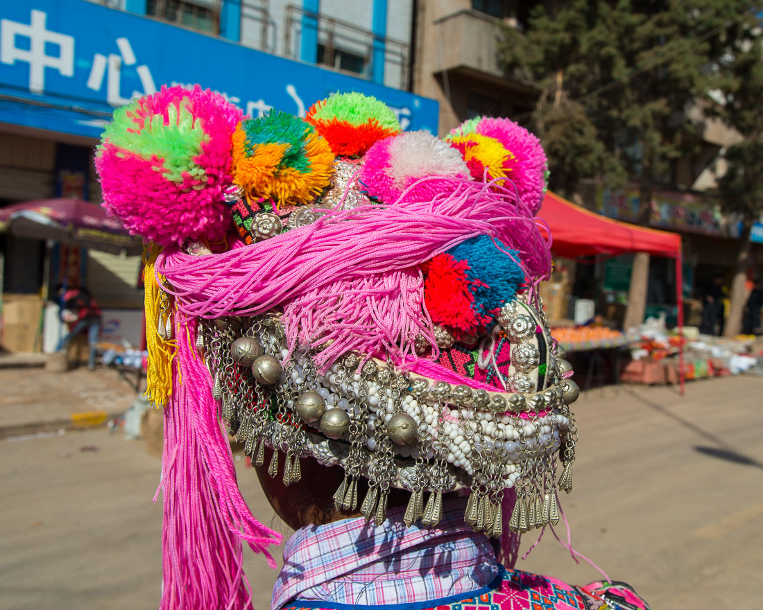 A colorful hat part of the traditional costume worn by the women from the Yi ethnic minority people. Mao Jie village, Wuding County, Yunnan Province, China, Asia. Nikon D4, 24-120mm, f/4.0, VR