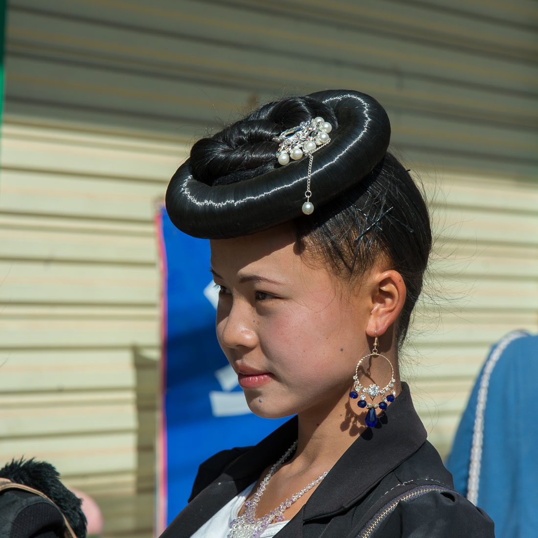 A traditional hair arrangement from the women of the Flower Miao ethnic minority people. Mao Jie village, Wuding County, Yunnan Province, China, Asia. Nikon D4, 24-120mm, f/4.0, VR