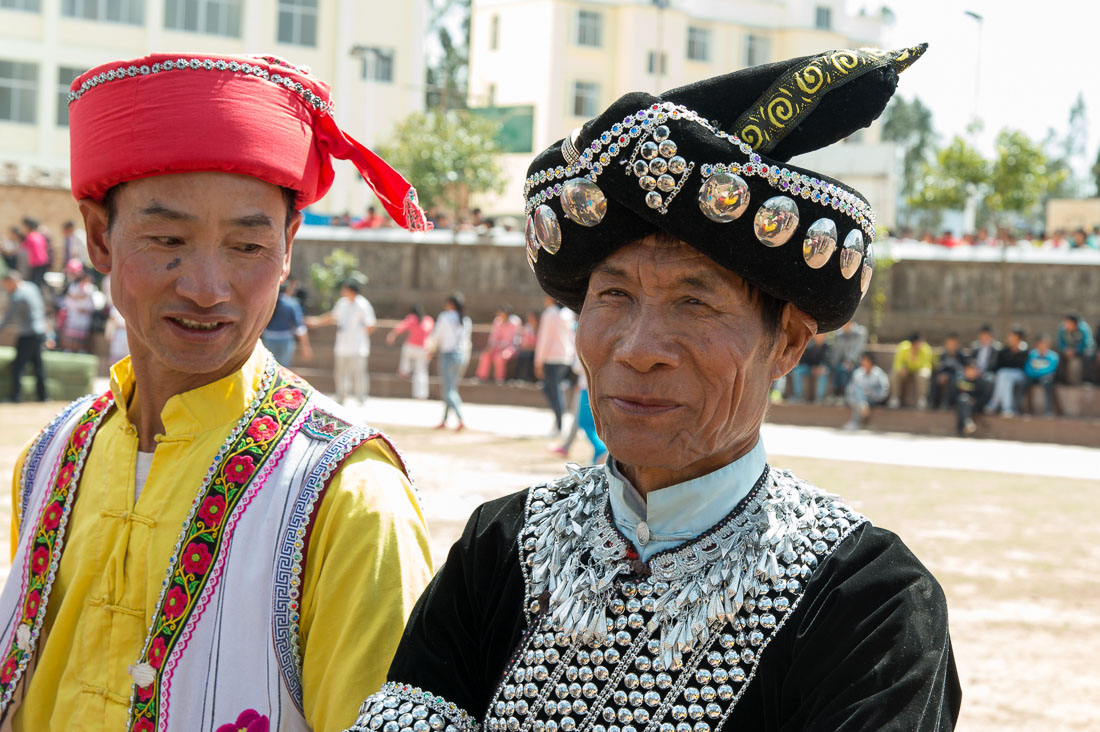 Colorful hats part of the traditional costumes worn by the men from the Yi ethnic minority people. Mao Jie village, Wuding County, Yunnan Province, China, Asia. Nikon D4, 24-120mm, f/4.0, VR