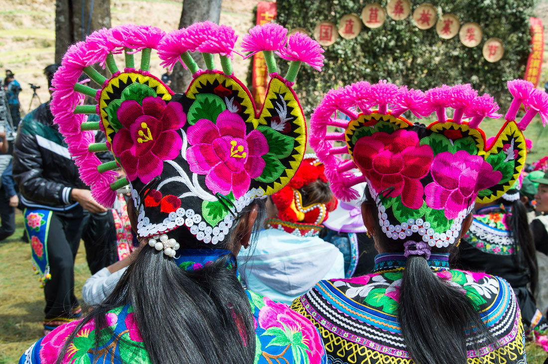 Colorful hats from the Yi ethnic minority people, at the annual festival in Zhi Ju village. Yong Ren County, Yunnan Province, China, Asia. Nikon D4, 24-120mm, f/4.0, VR