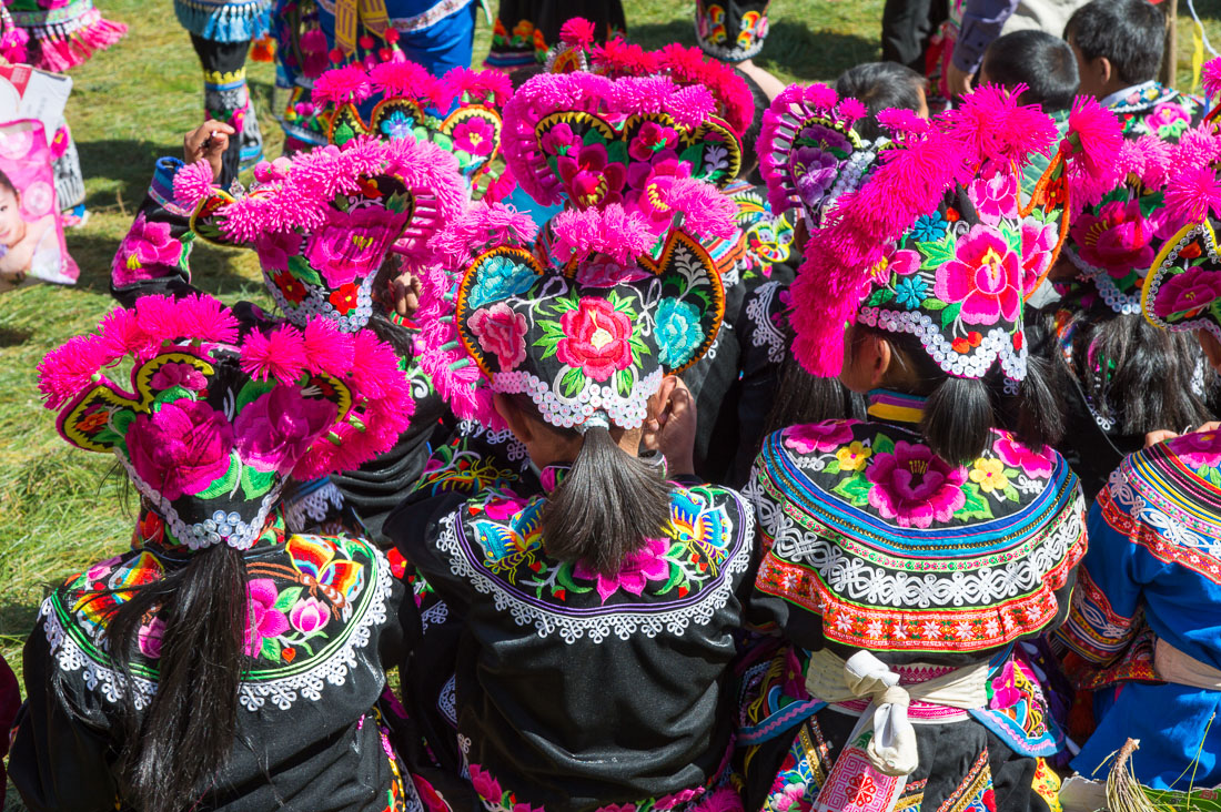 Colorful costumes of the Yi ethnic minority people, at the annual festival in Zhi Ju village. Yong Ren County, Yunnan Province, China, Asia. Nikon D4, 24-120mm, f/4.0, VR