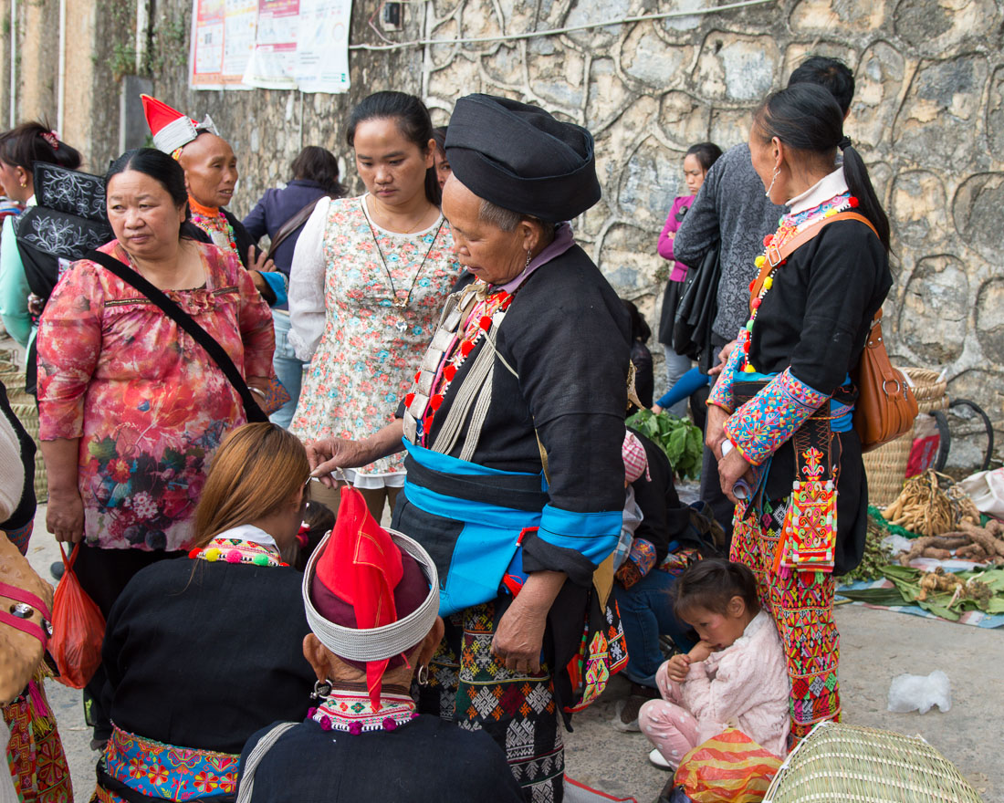 A shaman from the Yao ethnic minority people performing a ritual on a young woman. Jin Ping market, Yunnan Province, China, Asia. Nikon D4, 24-120mm, f/4.0, VR