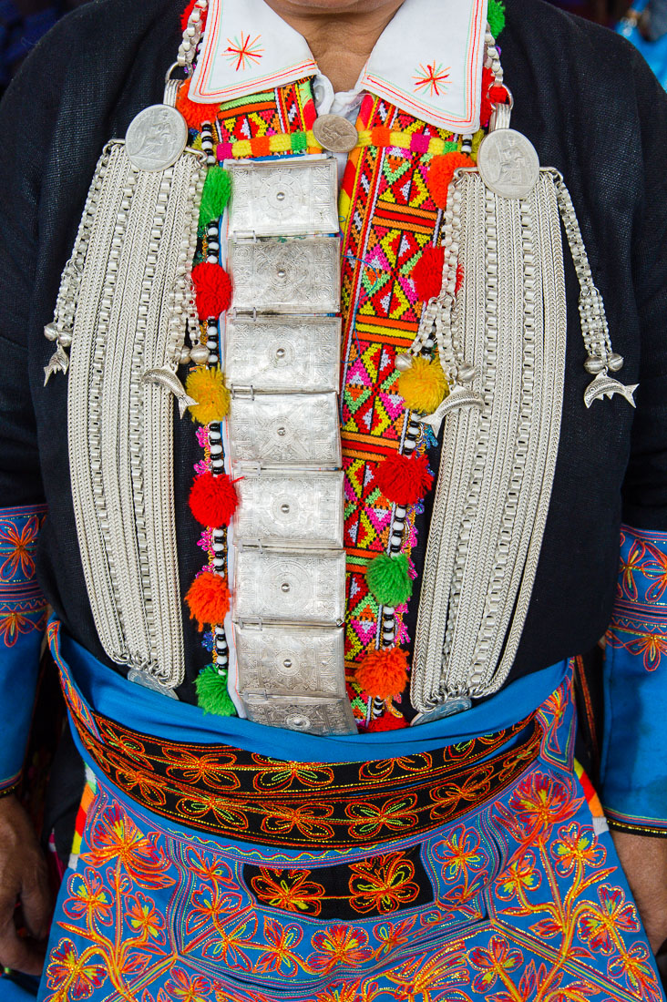 Particular from the colorful traditional costume used by Yao ethnic minority people. Jin Ping market, Yunnan Province, China, Asia. Nikon D4, 24-120mm, f/4.0, VR