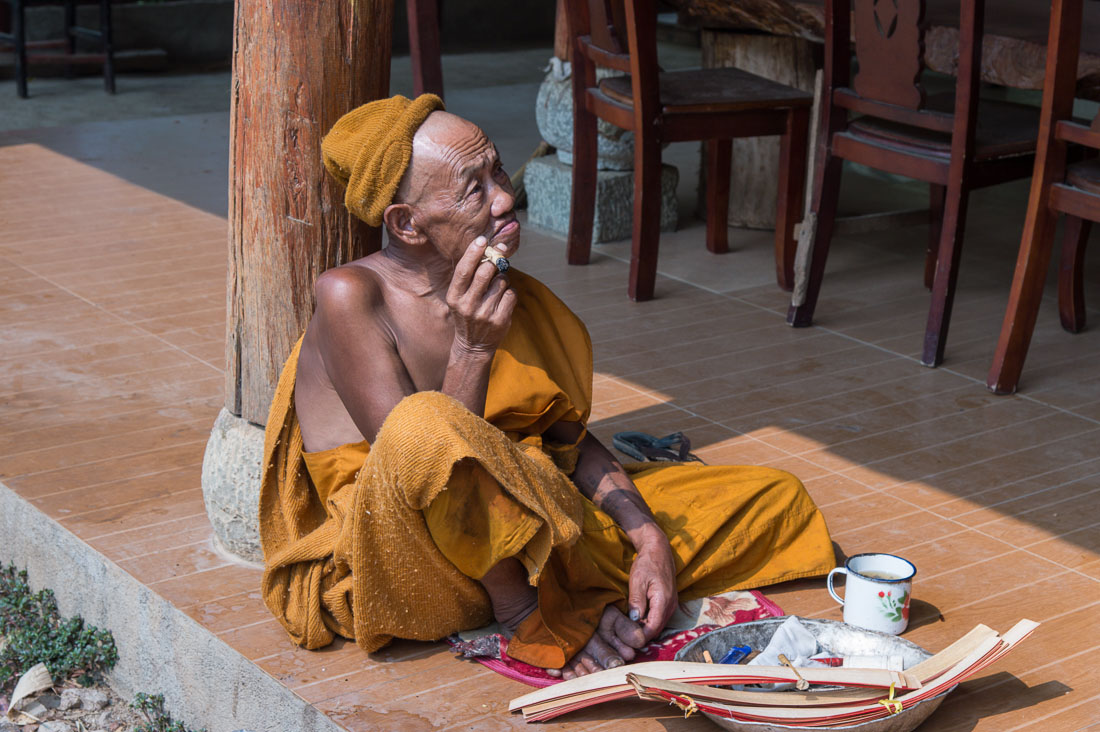 An old Buddhist monk from the remote village of Zhang Lang, Menghai County, Yunnan Province, China, Asia. Nikon D4, 24-120mm, f/4.0, VR