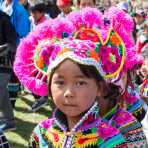Little girl wearing the traditional costume of the Yi ethnic minority people, at the annual costume festival at Zhi Ju village, Yong Ren County, Yunnan Province, China, Asia. Nikon D4, 24-120mm, f/4.0, VR