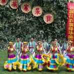 Men and women from the Yi ethnic minority people, performing traditional dance, wearing traditional colorful costumes at the annual festival in Zhi Ju village, Yong Ren County, Yunnan Province, China, Asia. Nikon D4, 70-200mm, f/2.8, VR II