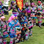 Women from the Yi ethnic minority people, in traditional colorful costume, dancing at the annual festival in Zhi Ju village, Yong Ren County, Yunnan Province, China, Asia. Nikon D4, 70-200mm, f/2.8, VR II