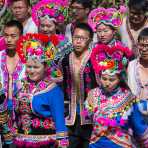 Boys and girls from the Yi ethnic minority people, in traditional colorful costume, performing at the annual festival in Zhi Ju village, Yong Ren County, Yunnan Province, China, Asia. Nikon D4, 70-200mm, f/2.8, VR II