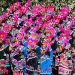 Girls from the Yi ethnic minority people, in traditional colorful costume, performing at the annual festival in Zhi Ju village, Yong Ren County, Yunnan Province, China, Asia. Nikon D4, 70-200mm, f/2.8, VR II