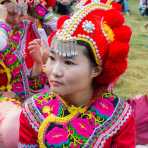 Colorful costumes of the Yi ethnic minority people, at the annual festival in Zhi Ju village. Yong Ren County, Yunnan Province, China, Asia. Nikon D4, 24-120mm, f/4.0, VR