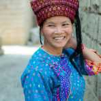 A joyful woman from the Dai ethnic minority people wearing the traditional costume. Zhe Ga village, Yuan Jing County, Yunnan Province, China, Asia. Nikon D4, 24-120mm, f/4.0, VR