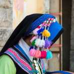 Colorful hat from the traditional costume worn by the women from the Yi ethnic minority people.  Yuang Yang market, Yunnan Province, China, Asia. Nikon D4, 24-120mm, f/4.0, VR