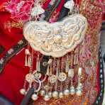 Silver pendants, part of the traditional costume from the Miao ethnic minority people. Sha La Tuo market, Yunnan Province, China, Asia. Nikon D4, 24-120mm, f/4.0, VR