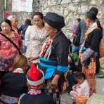 A shaman from the Yao ethnic minority people performing a ritual on a young woman. Jin Ping market, Yunnan Province, China, Asia. Nikon D4, 24-120mm, f/4.0, VR