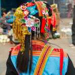 Traditional costume worn by the women from the Yao ethnic minority people. Jin Shui He market, Jin Ping County, Yunnan Province, China, Asia. Nikon D4, 24-120mm, f/4.0, VR