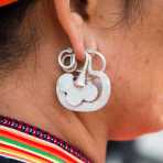 Traditional earring worn by the women from the Yao ethnic minority people. Jin Shui He market, Jin Ping County, Yunnan Province, China, Asia. Nikon D4, 24-120mm, f/4.0, VR