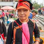 A beautiful woman from the Yao ethnic minority people wearing the traditional costume. Jin Shui He market, Jin Ping County, Yunnan Province, China, Asia. Nikon D4, 24-120mm, f/4.0, VR