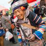 An old woman from the Ha Ni ethnic minority people in traditional costume. Mang Xin market, Meng Lian County, Yunnan Province, China, Asia. Nikon D4, 24-120mm, f/4.0, VR