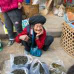 A joyful old woman selling tea at the Lan Chang market, Yunnan Province, China, Asia. Nikon D4, 24-120mm, f/4.0, VR