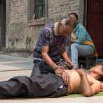 Chinese shaman from the La Hu ethnic minority people, performing acupunture. Lao Ba Dao village, Lan Cang County, Yunnan Province, China, Asia. Nikon D4, 24-120mm, f/4.0, VR