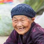 An old and joyful woman at Jin Shui market, Jin Ping County, Yunnan Province, China, Asia. Nikon D4, 70-200mm, f/2.8, VR II