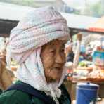 A very old woman from the Dai ethnic minority people. The market at Mang Xin, Meng Lian County, Yunnan Province, China, Asia. Nikon D4, 24-120mm, f/4.0, VR