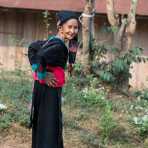 An old woman from the Black Hmong people ethnic minority, wearing her traditional costume, Ouay Xay district. Lao PDR,, Indochina, South East Asia