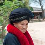 An old woman from the Yao people ethnic minority wearing her traditional costume and a large turban, Luang Namtha Province. Lao PDR, Indochina, South East Asia