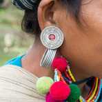 Earring of a woman from the Akha Mouchi people ethnic minority, Eupeuchimg village, Phongsali province, Lao PDR, Indochina, South east Asia.