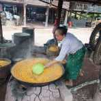 Woman boiling corn in Patoy village (the 'whiskey village) to produce corn spirit, Patoy village, Luang Namtha province, Lao PDR, Indochina, South East Asia.
