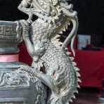 A dragon on a bronze ceremonial vase at the entrance of the Chinese Wat Horkang, Vientiane, Lao PDR, Indochina, South East Asia.