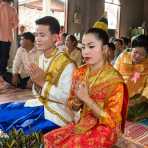The groom and the bride, in full traditional Lao costume, during the wedding cerimony, Ving Keo Ban, Sainyabuli province. Lao PDR, Laos, Indochina, South East Asia